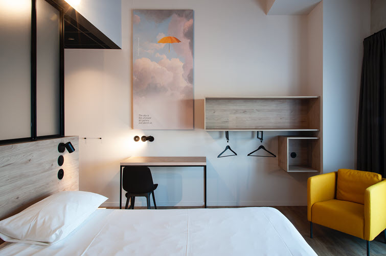 This artist-themed hotel room is bursting with accents from the Unilin Decorative Range 